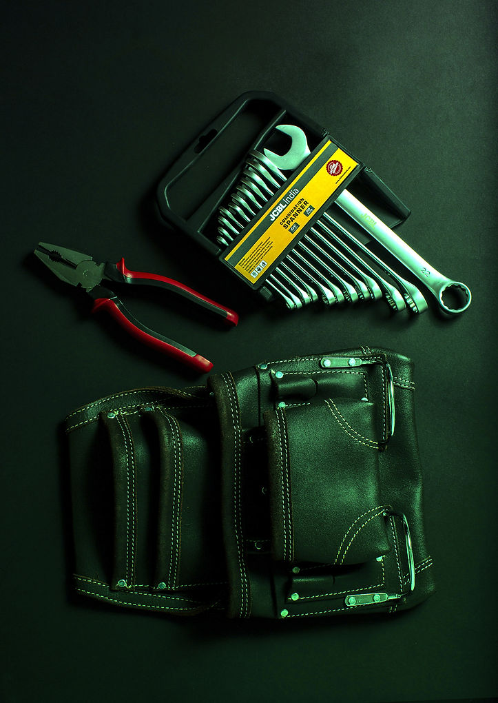 hand-tool-on-black-leather-bag-3784234 c