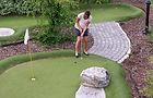 Women playing miniature golf