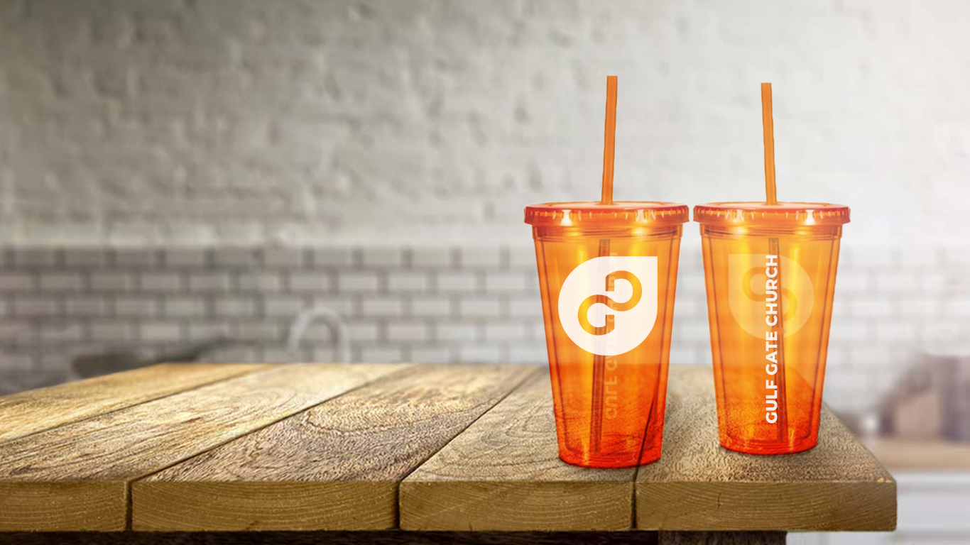 orange GGC tumblers on a table