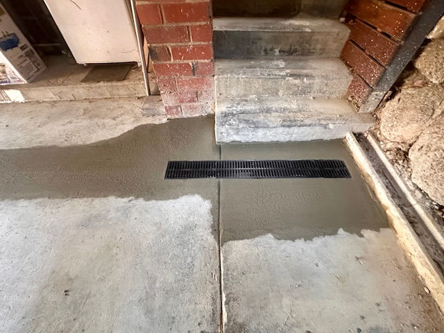 CONCRETE AROUND STRIP GRATE