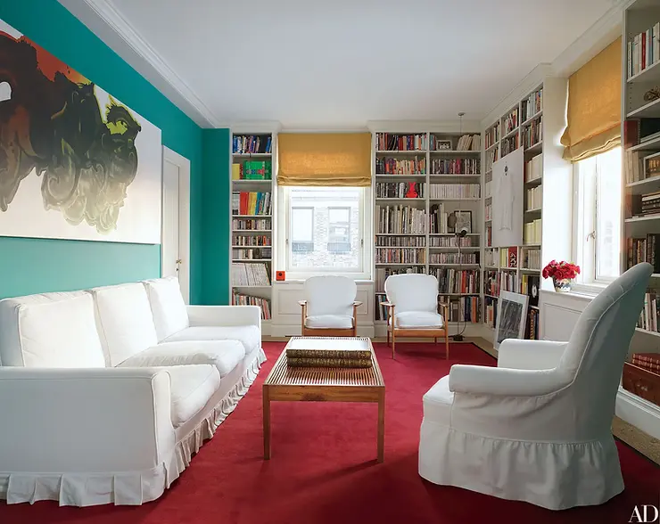 Transitional living room with color blocked walls and carpet