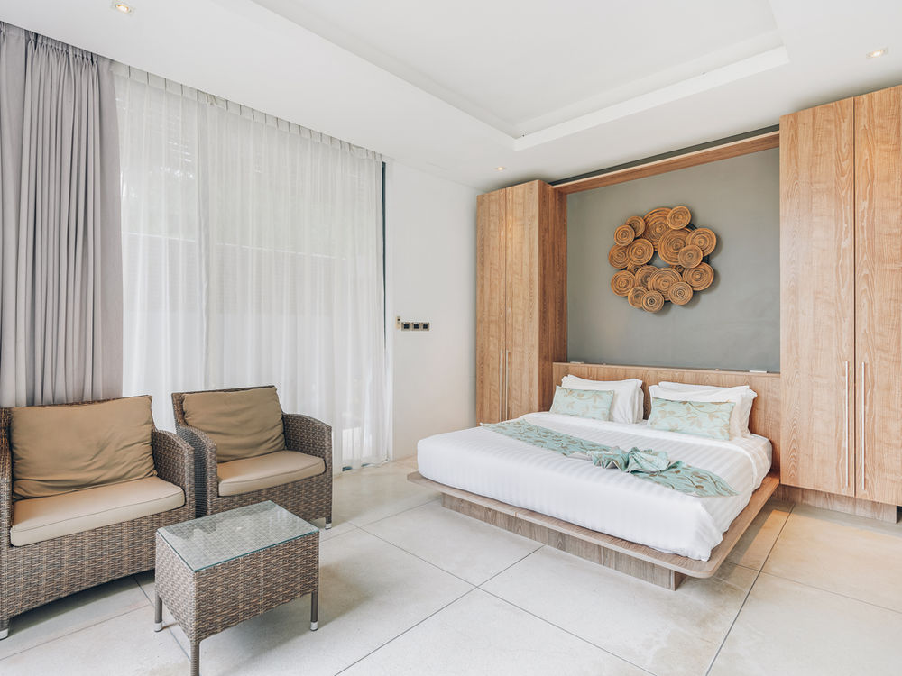 Bedroom with contemporary built-in furniture at Villa Neung