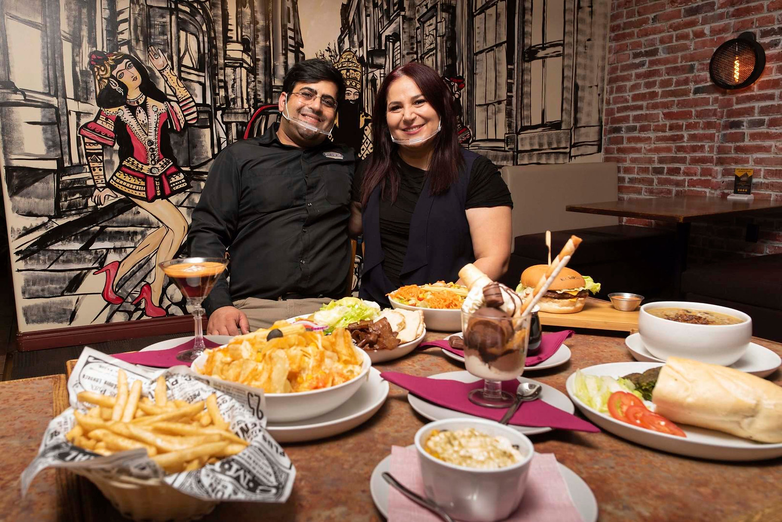 Mona and Payam, owners of Next Stop Cafe in Winnipeg