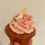 Thumbnail: Photo of pink cupcakes with  vanilla buttercream and raspberry sponge.