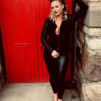 Rocker chick Synthetik Blonde poses for band promo photo shoot