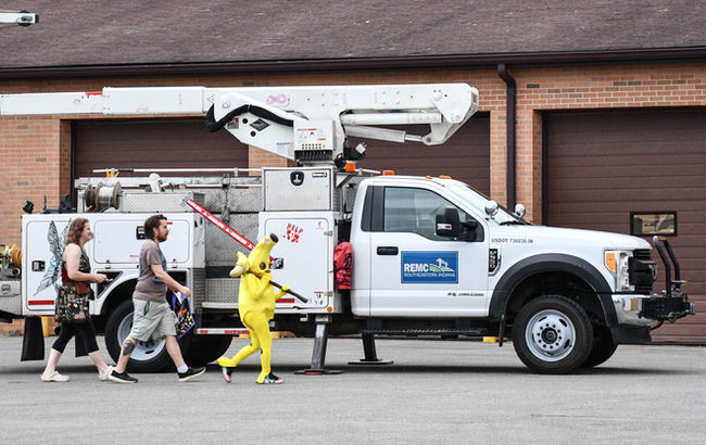 family by SEI REMC bucket truck