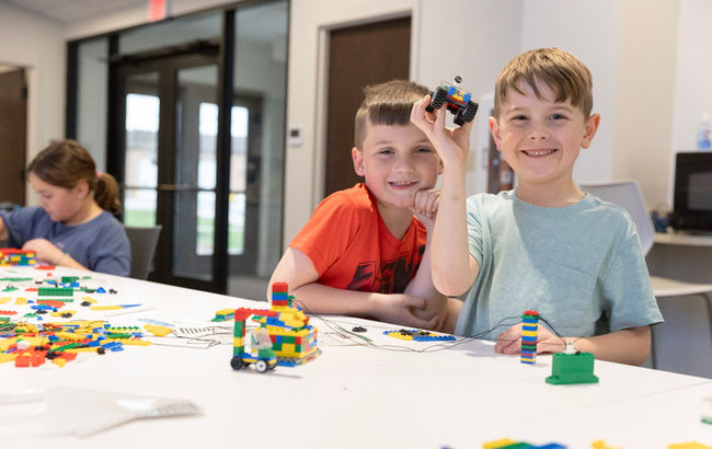 two boys with legos