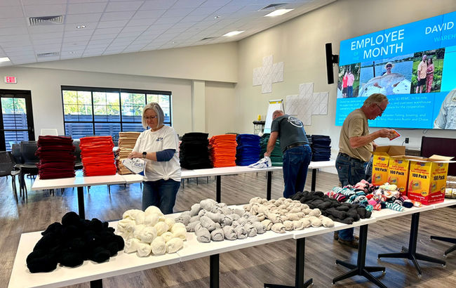 SEI REMC employees assembling Comfort Care Kits