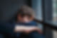 Pensive-sad-boy-teenager-in-a-blue-shirt-and-jeans-sitting-at-the-window-and-closes-his-fa