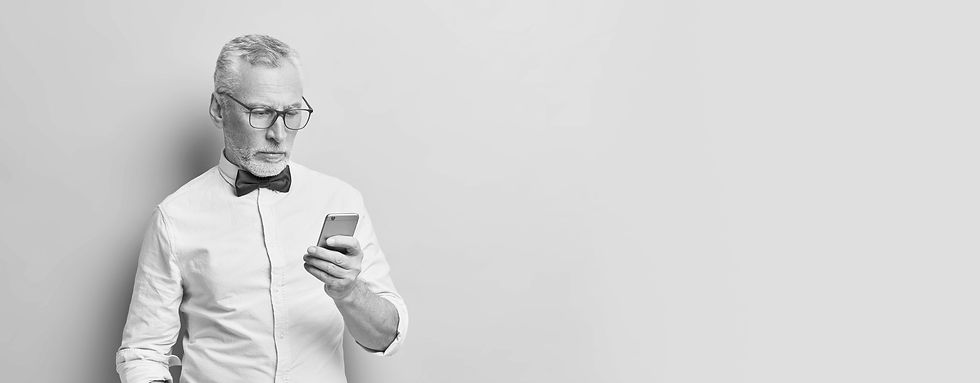 serious-mature-man-uses-smartphone-reads-news-online-keeps-hand-pocket-being-always-touch-