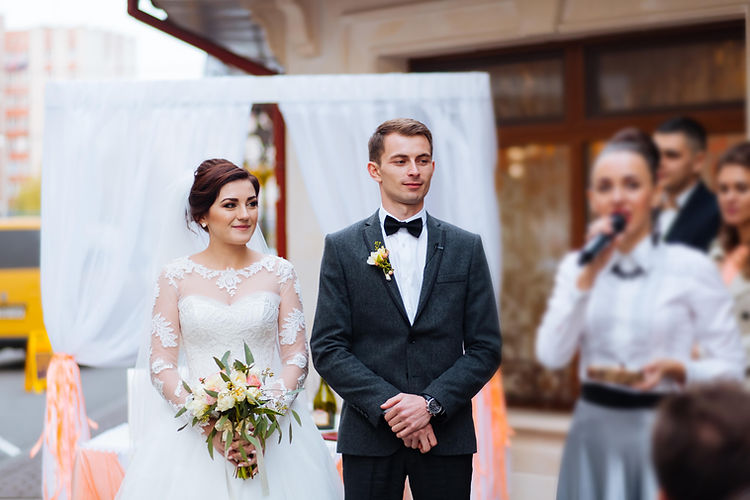portrait-handsome-groom-putting-wedding-ring-brides-hand-registry-office-88.jpg