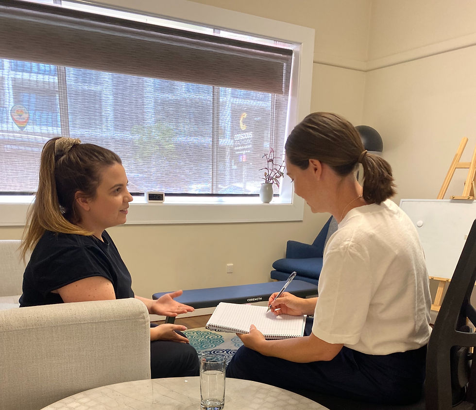 Dietician Jacqueline Jacqui Tyler with a client in a session in the Conscious Health Clinic in Wollongong sitting on two chairs