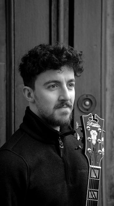 Man with a D'Angelico guitar