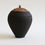 Thumbnail: Black ceramic lidded jar