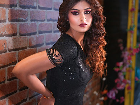 Elegant fashion makeup look with soft curls, bold smokey eyes and flawless party makeup by First Foundation Pro, a professional makeup academy in Hyderabad offering fashion makeup courses, professional makeup artist training, hairstyling classes and beauty certification.