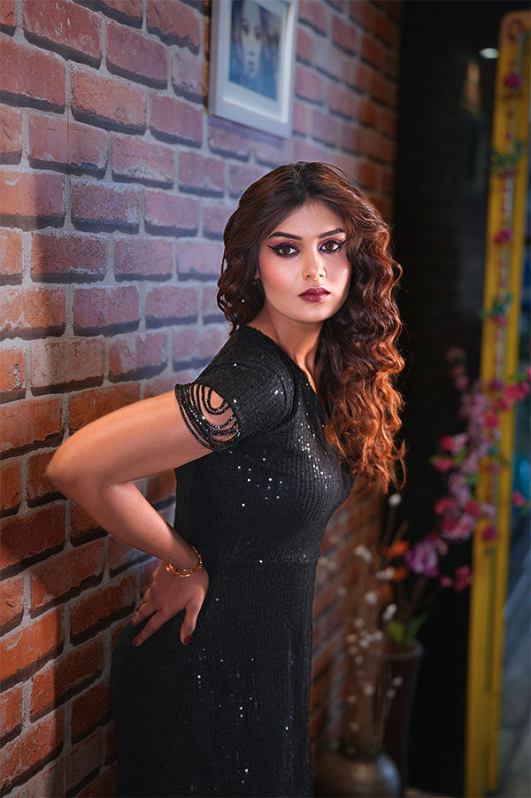 Elegant fashion makeup look with soft curls, bold smokey eyes and flawless party makeup by First Foundation Pro, a professional makeup academy in Hyderabad offering fashion makeup courses, professional makeup artist training, hairstyling classes and beauty certification.