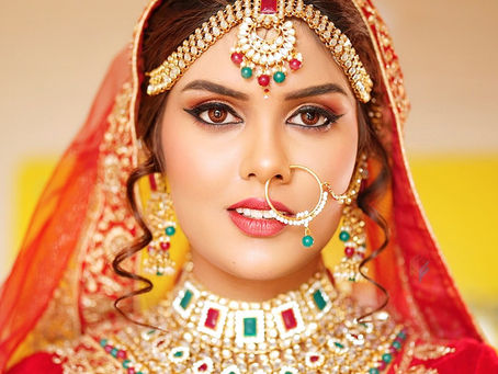 Professional bridal makeup with traditional bridal jewelry, flawless skin and elegant bridal styling by First Foundation Pro, top-rated makeup academy in Hyderabad.