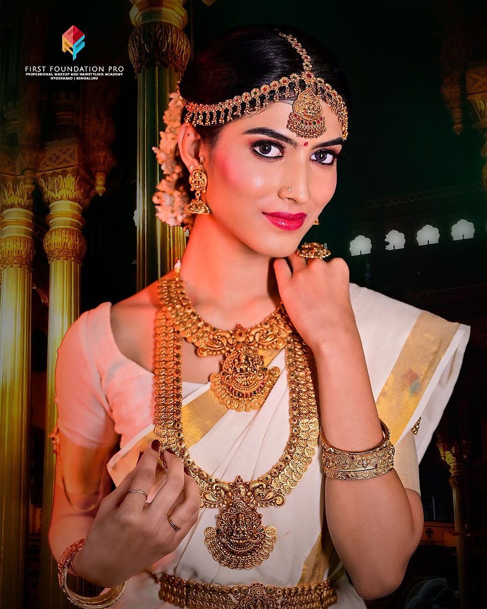 South Indian bridal makeup with traditional gold jewelry and saree look by First Foundation Pro – professional makeup and hairstyling academy in Hyderabad and Bengaluru specializing in bridal, fashion and celebrity makeup training with expert trainers and advanced techniques.