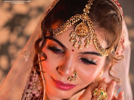 HD bridal makeup look with glitter eyeshadow, bridal jewelry and radiant skin by First Foundation Pro makeup academy in Hyderabad offering advanced bridal makeup certification courses.