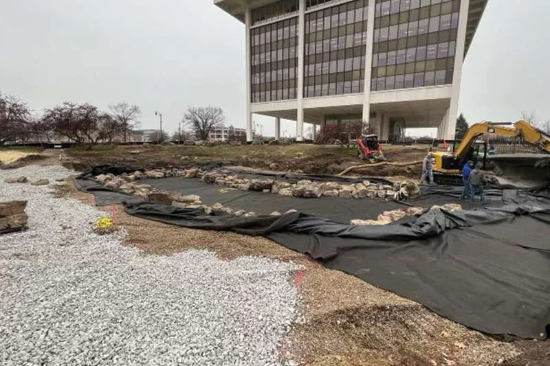 An outdoor commercial space with unfinished landscaping. 