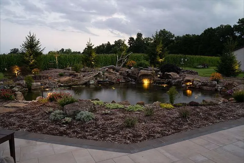 A natural pond built in a residential backyard by Knob Hill Landscaping Company in Springfield, Illinois. 