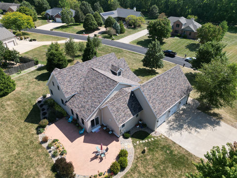 Residential home with a new roof replacement by Copper Creek Contractors of Champaign, Illinois.