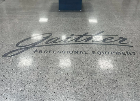 Logo printed onto a concrete floor and then sealed with polish by Rescue Concrete of Springfield, IL.