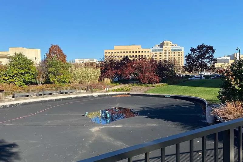 An outdoor commercial space with unfinished landscaping. 