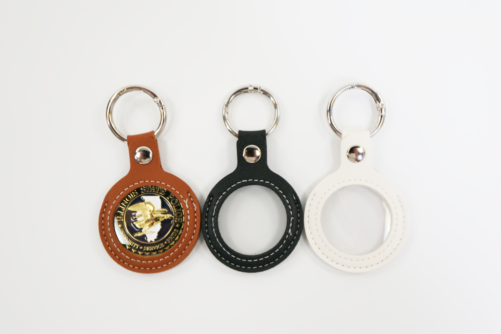 3 faux leather keychains in brown, black, and white. Coin holder keychain for challenge coins.