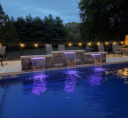Waterfall features on backyard pool. Designed and installed by Knob Hill Landscape in Springfield, IL.
