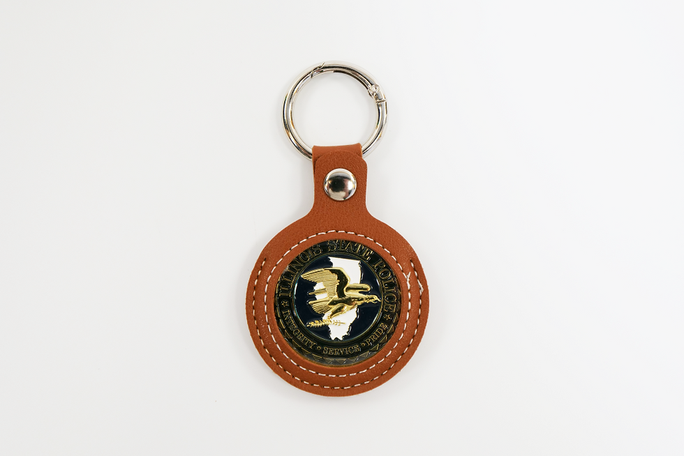 Thumbnail: A faux leather brown keychain coin holder