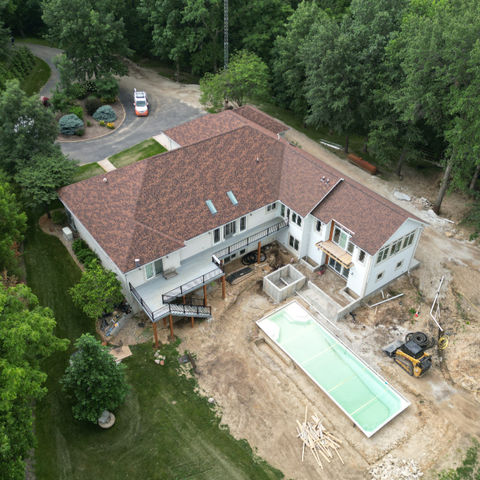 Modern residential home with a new addition, siding, windows, and doors installed by Copper Creek Contractors of Champaign, Illinois