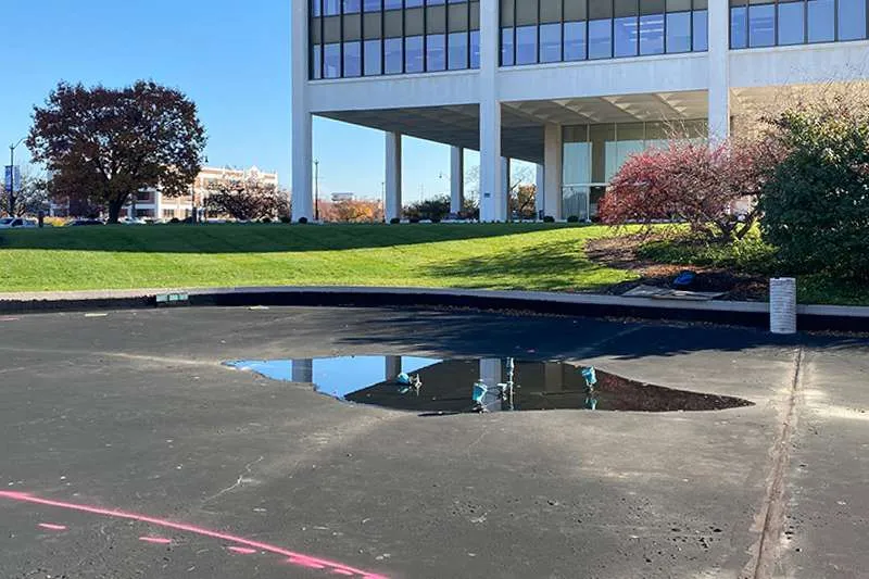 An outdoor commercial space with unfinished landscaping. 
