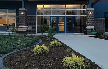 The front entrance to Pleasant Plains High School with featured landscaping completed by Knob Hill Landscape Company of Illinois