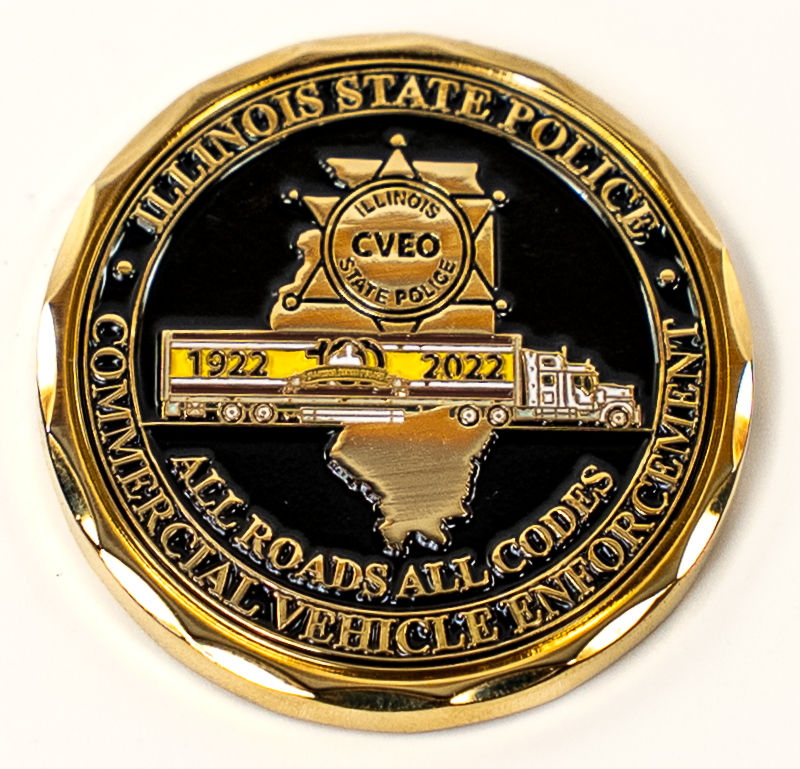 A commemorative challenge coin representing the Commercial Vehicle Enforcement Division of the Illinois State Police.