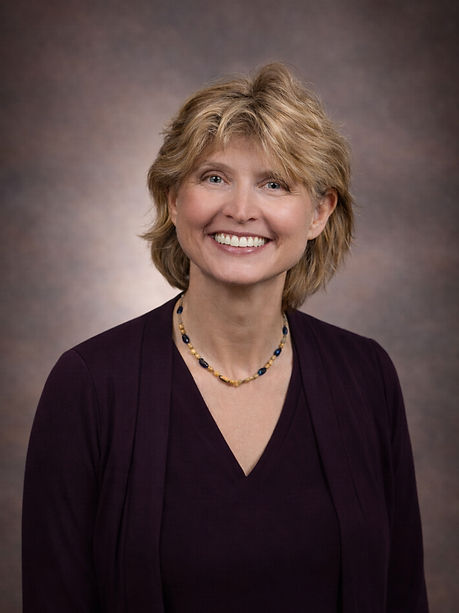 Smiling woman in purple blazer_edited.jpg