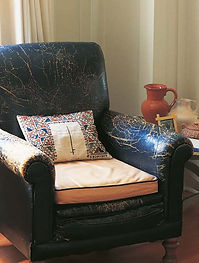 Vintage leather chair with pillow