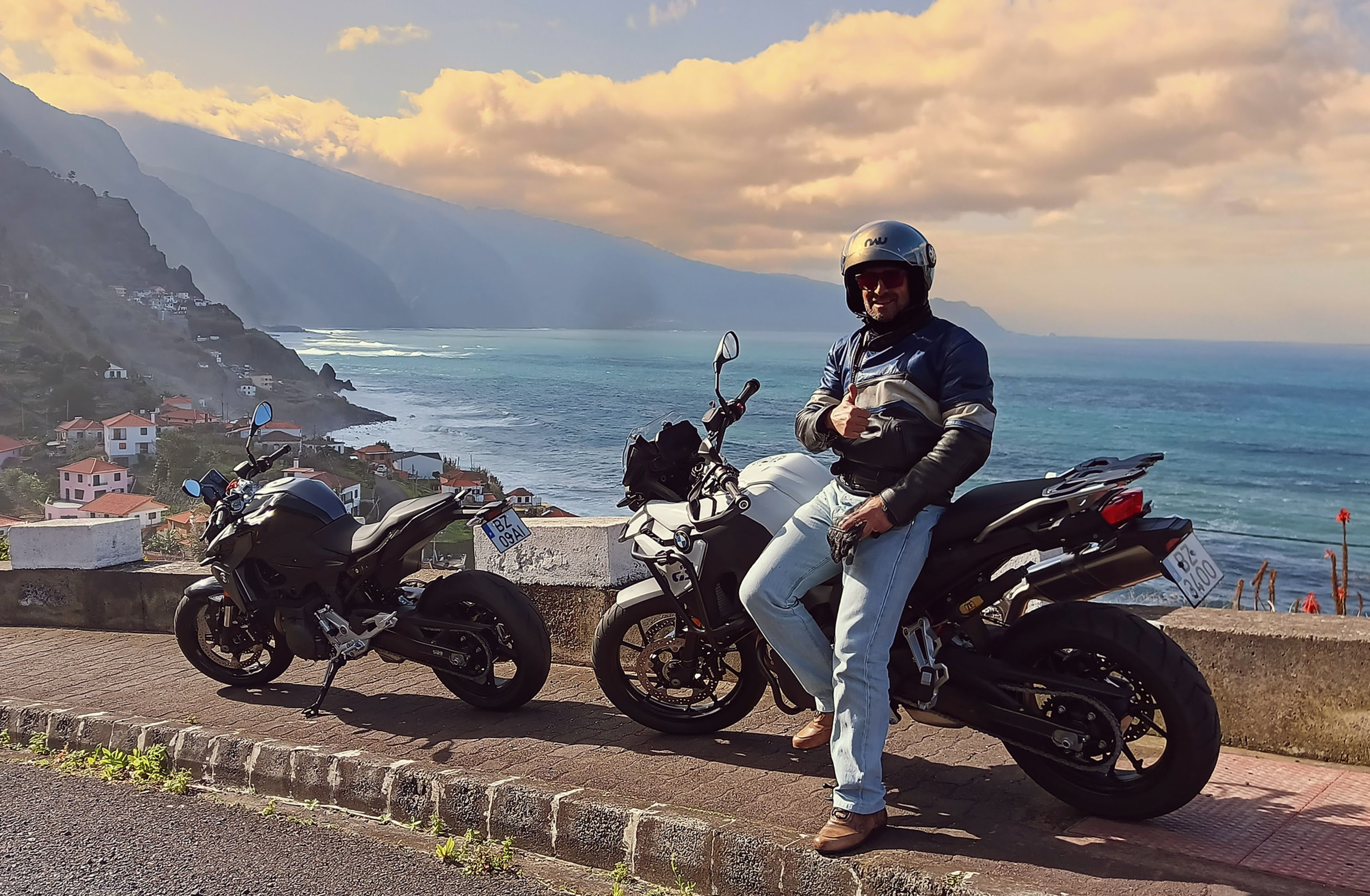 Male rider on private Madeira motorcycle tour with two BMW GS bikes on scenic mountain road