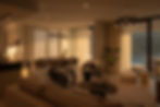 Open-plan living and dining area in warm evening light