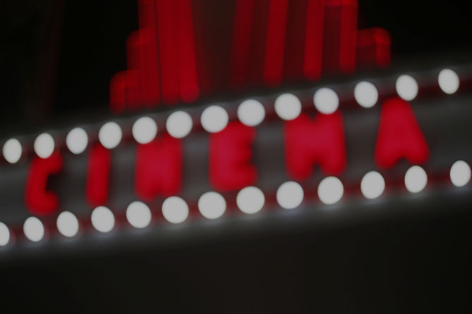 Blurred retro cinema sign with light bulbs_edited.jpg