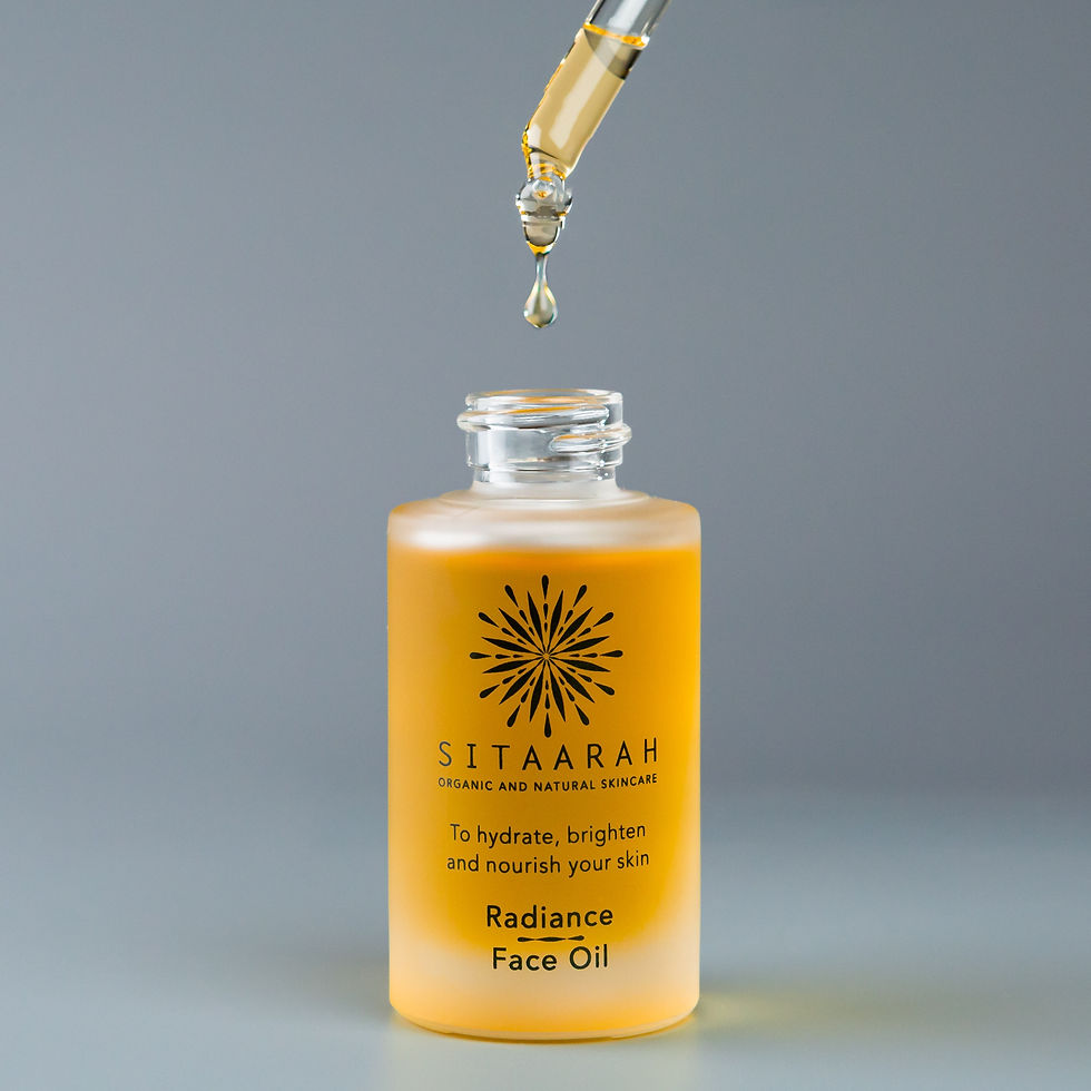 Dropper glass bottle containing face oil