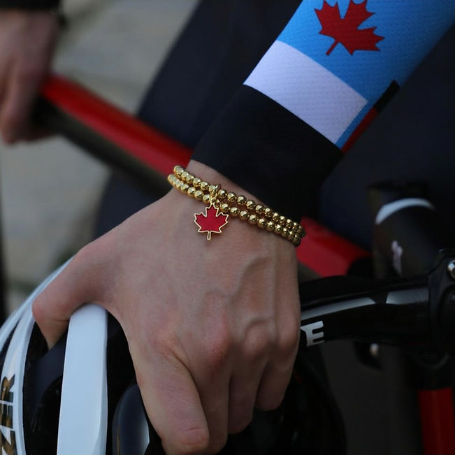 Sarah Orban with Commonwealth Team Canada Bracelet gold & red Canadian Maple Leaf.jpg