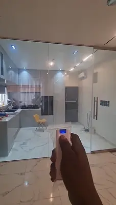 Smart glass divider between kitchen and living room in Lekki home