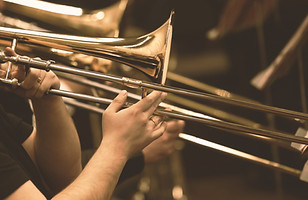 Hands of man playing the trombone