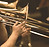 Hands of man playing the trombone