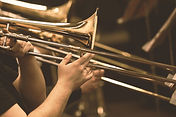 Hands of man playing the trombone