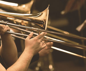 Hands of man playing the trombone