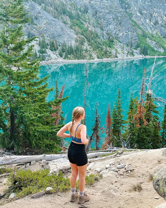 a woman at colchuck lake
