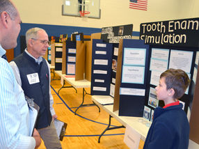 St. Leo Science Fair Sharing what they learned with judges, their parents
