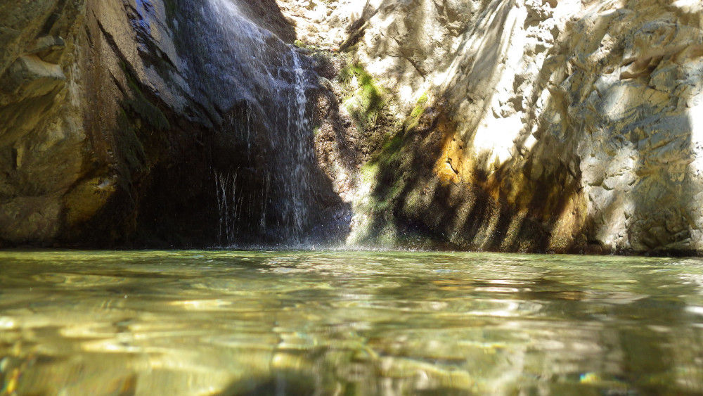 calm light blue sea and the edge of a limestone rocky coast near Xylofagou village
